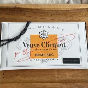 Veuve Cliquot white handbag with orange and black accents and chain strap